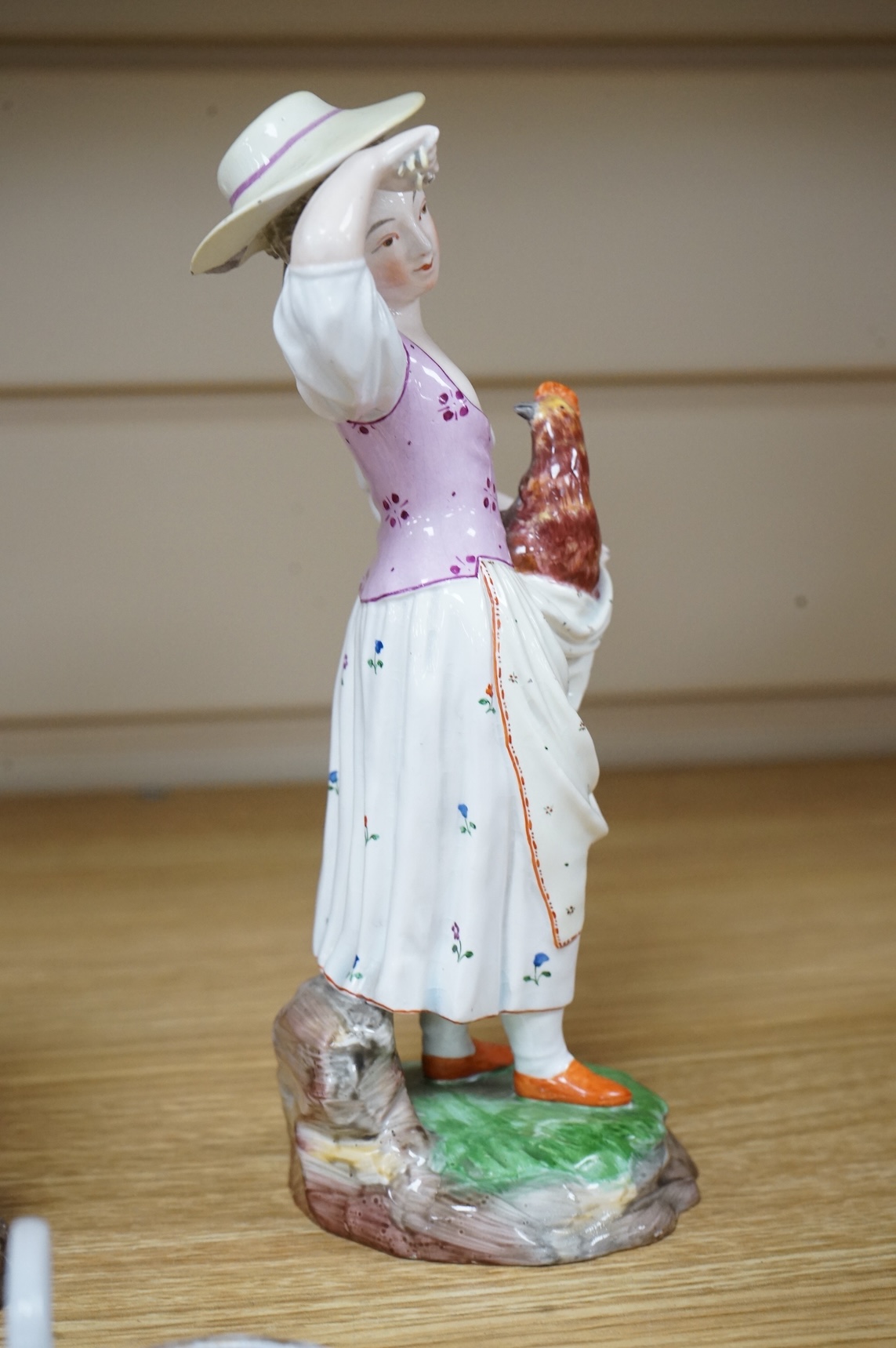 A pair of 19th century Hochst Damm faience figures and a Meissen twin section salt, tallest figure 20cm